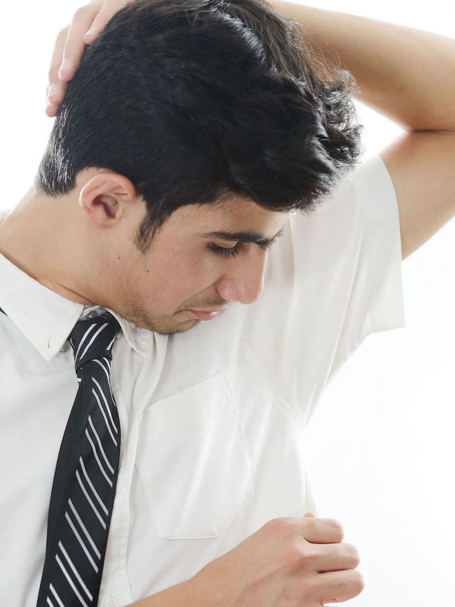 Businessman with sweaty underarms